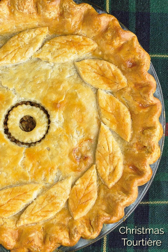 Rock Recipes Christmas Tourtière photo of uncut pie with title text added for Pinterest