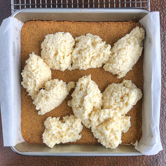 The center conconut layer being added to Coconut Dream bars before baking.