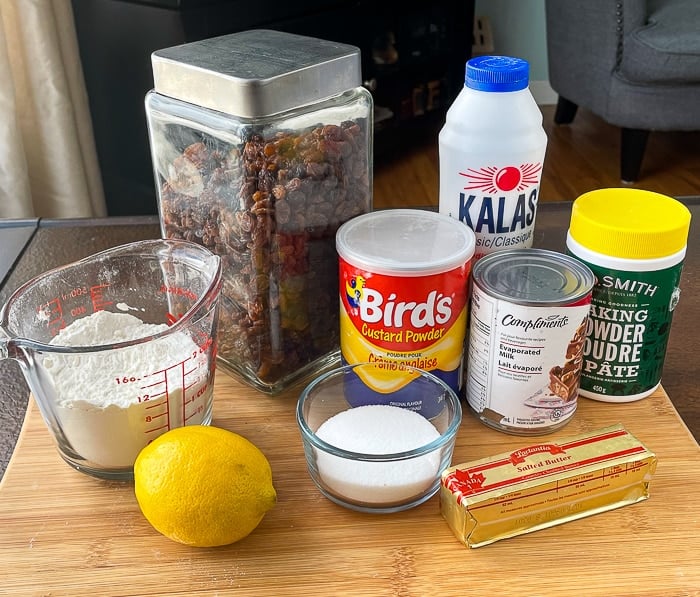 Ingredients for Custard Tea Buns on a wooden cutting board