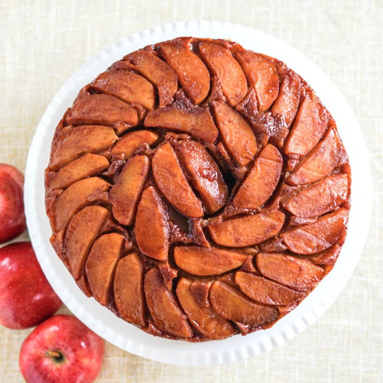 Overhead shot of Apple Upside down cake square cropped featured image