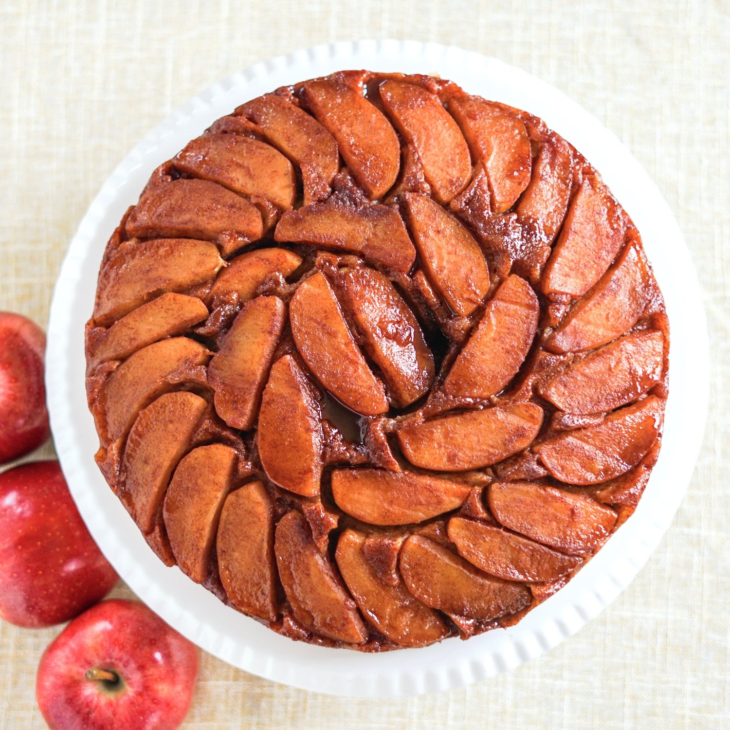Overhead shot of Apple Upside down cake square cropped featured image