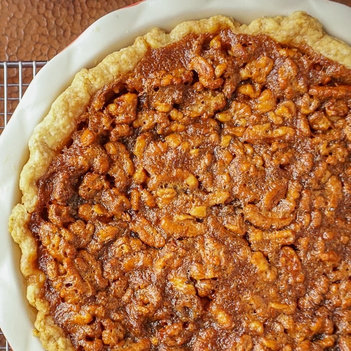 Close up photo of uncut Maple Walnut Pie