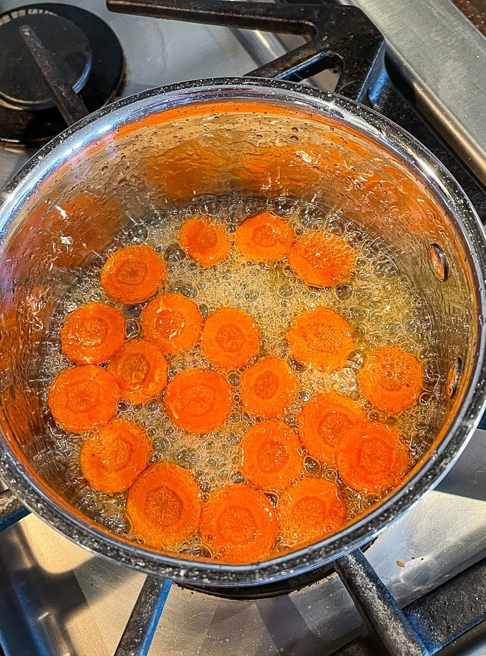 For a garnish simmer the carrot slices in sugar and water