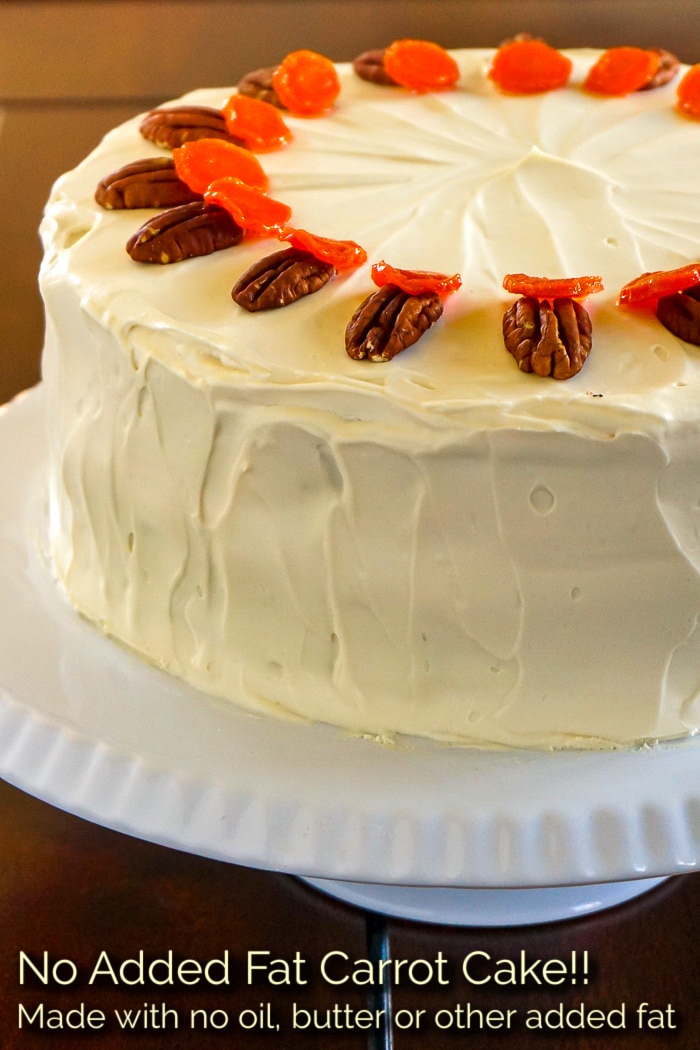 Photo of an uncut no added fat carrot cake with title text added for Pinterest