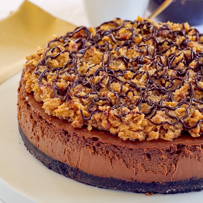 Uncut German Chocolate Cheesecake on a white plate