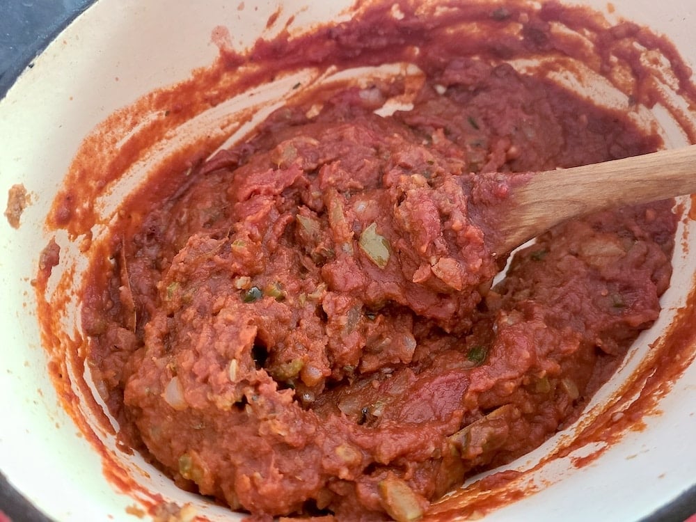 Adding the tomato mixture to th roux