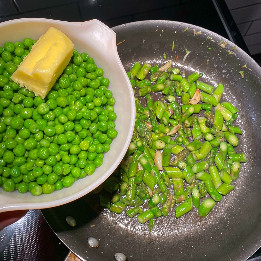 Adding the peas to the asparagus