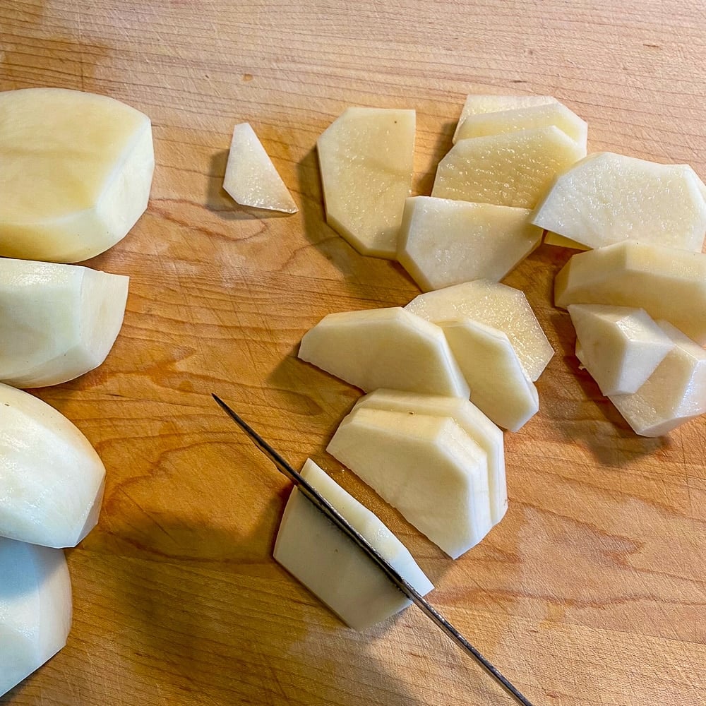 Cutting potatoes for fish and brewis