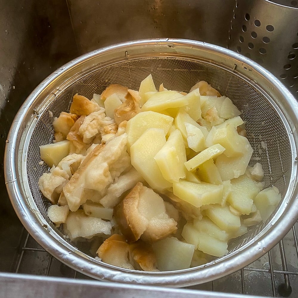 Drain the boiled hard tack and potatoes