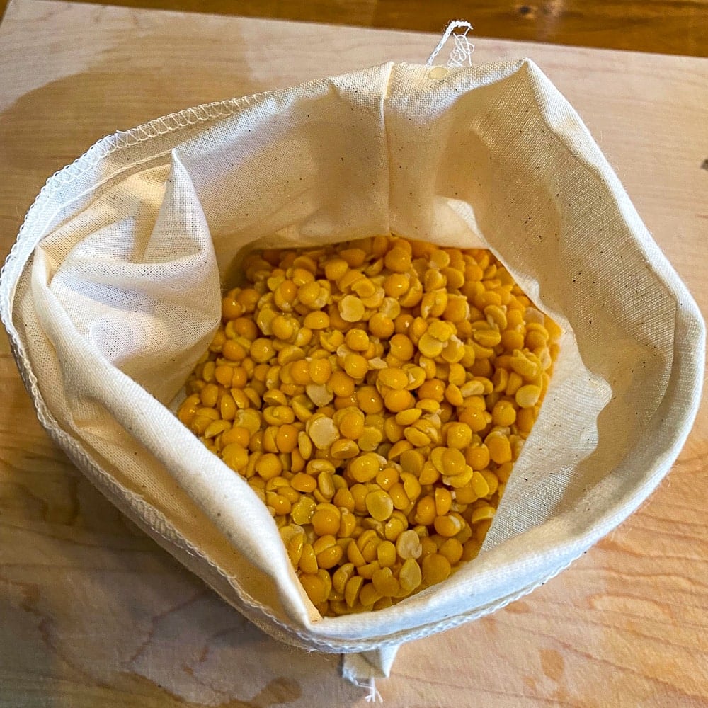 Split peas soaked and rinsed peas in the cloth bag