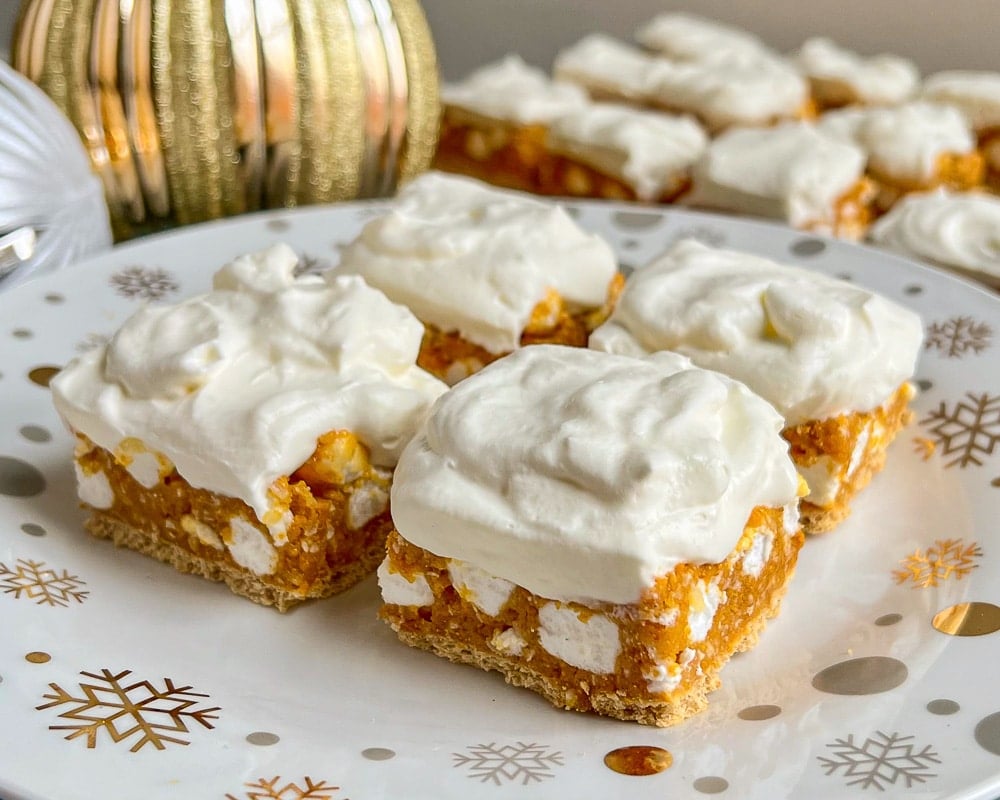 No Bake Winter White Cookies wide shot photo on a gold and white plate