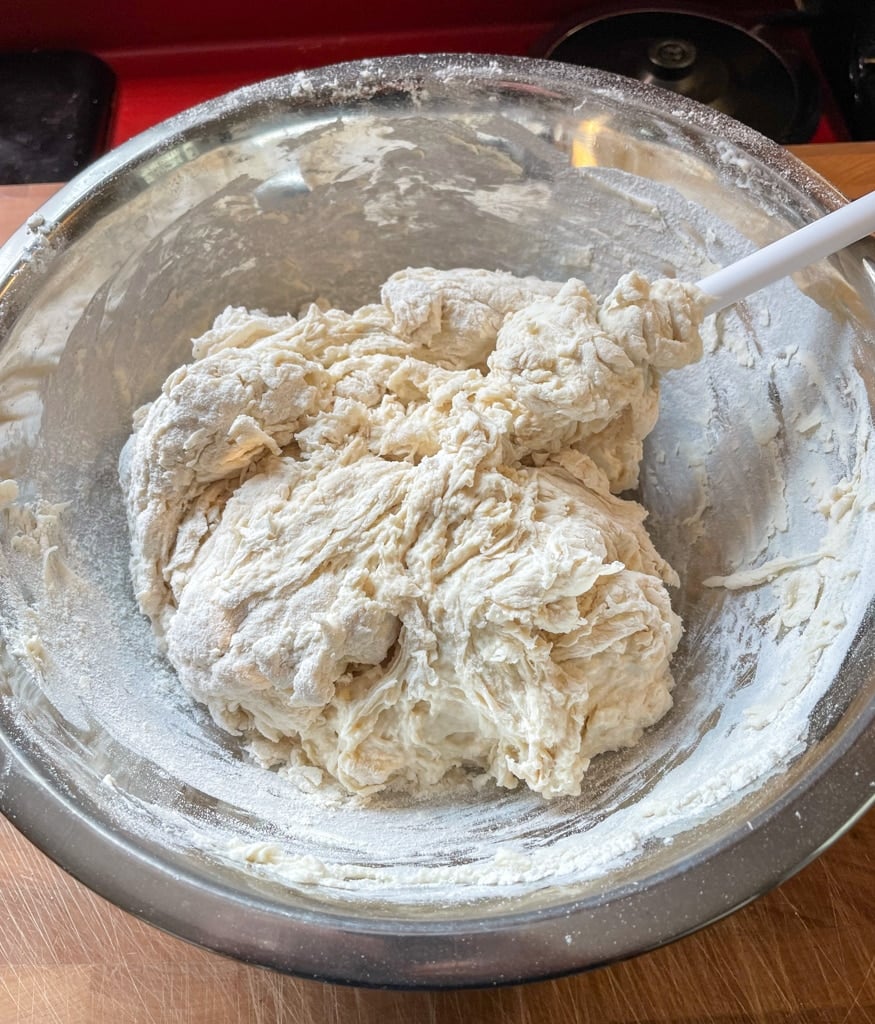 The dough coming together into a ball.