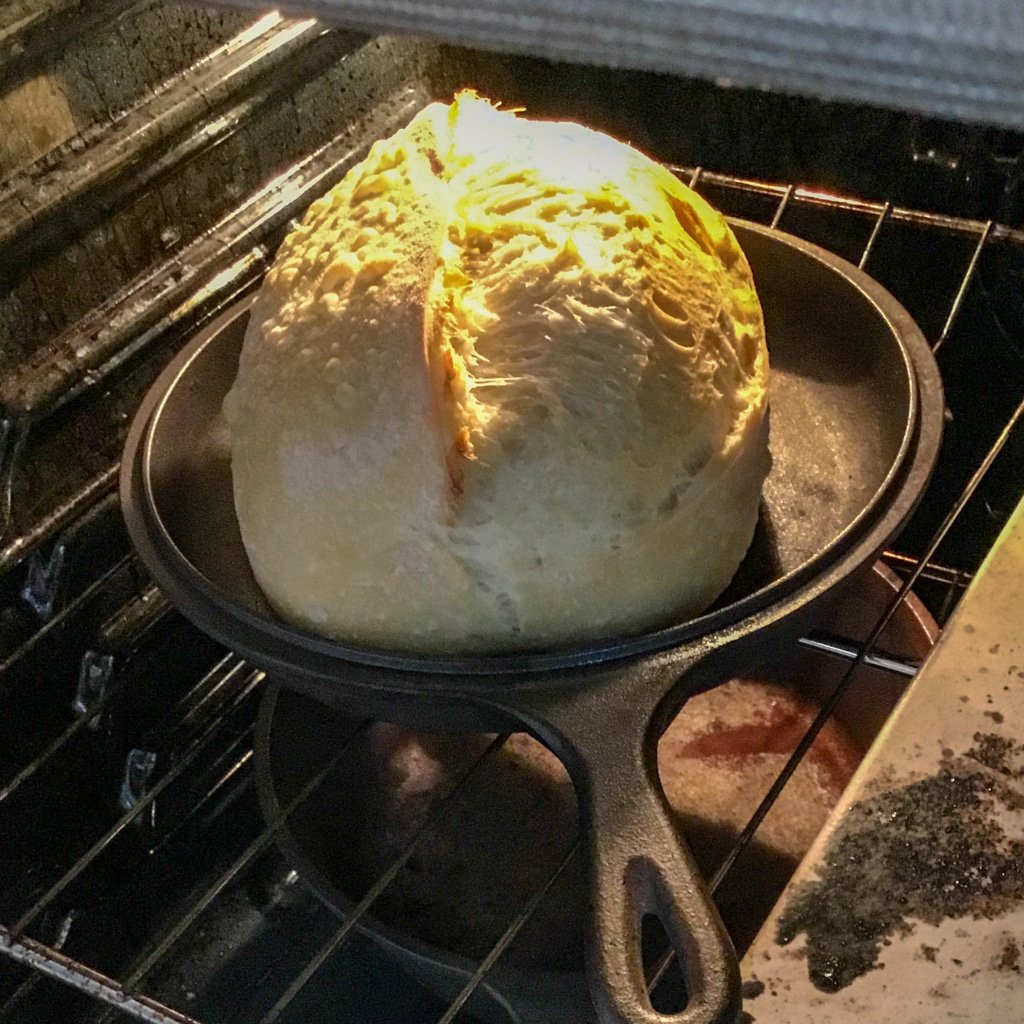 How to make artisan sourdough. Remove the cover from the loaf of bread.