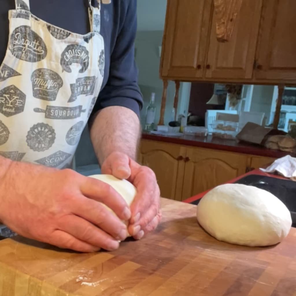 Turn the dough balls over.
