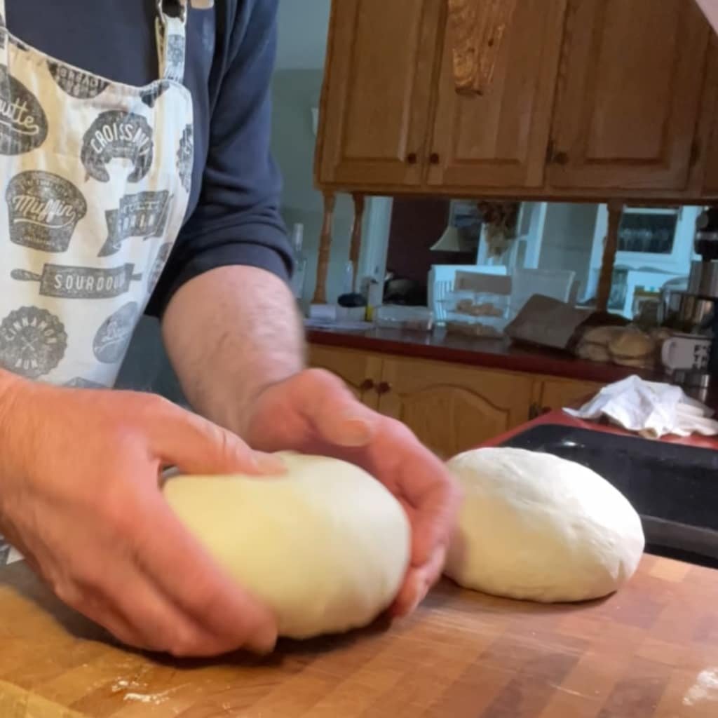 Leave the two balls of dough to rest on countertop