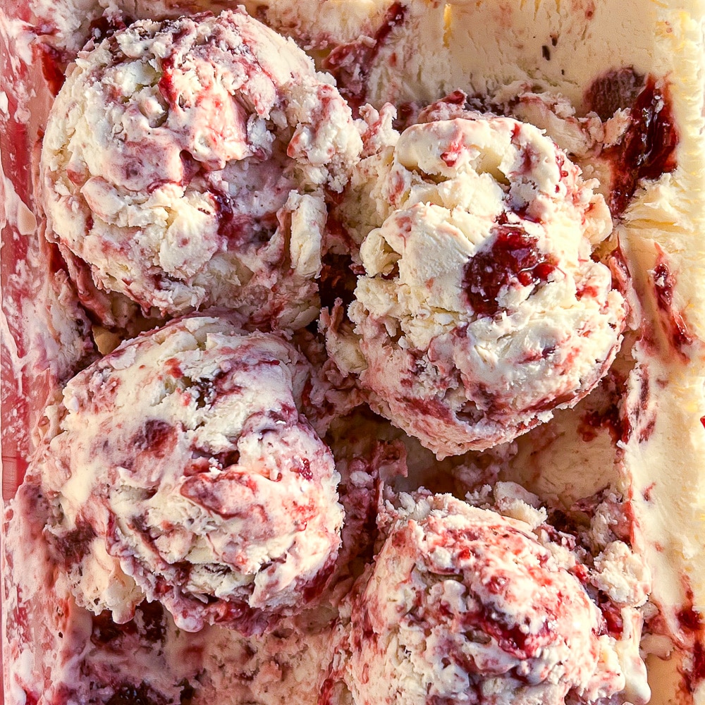 No Churn Strawberry Vanilla Ice Cream close up photo of scooped ice cream