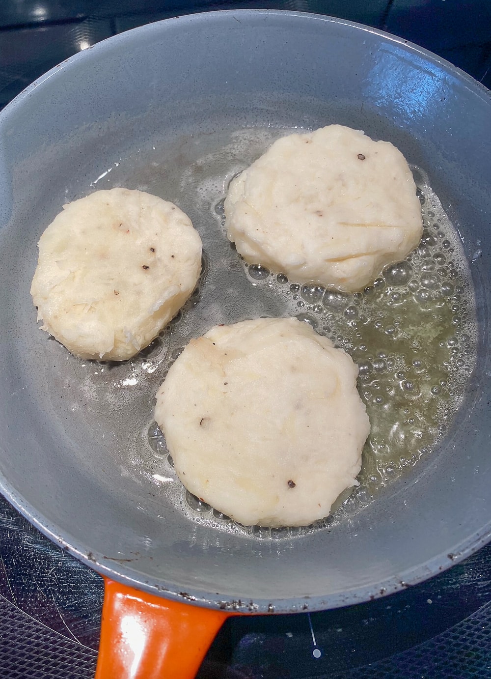 Irish Potato Cakes boxty going into the pan.