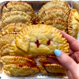 A big batch of freshly baked strawberry hand pies.