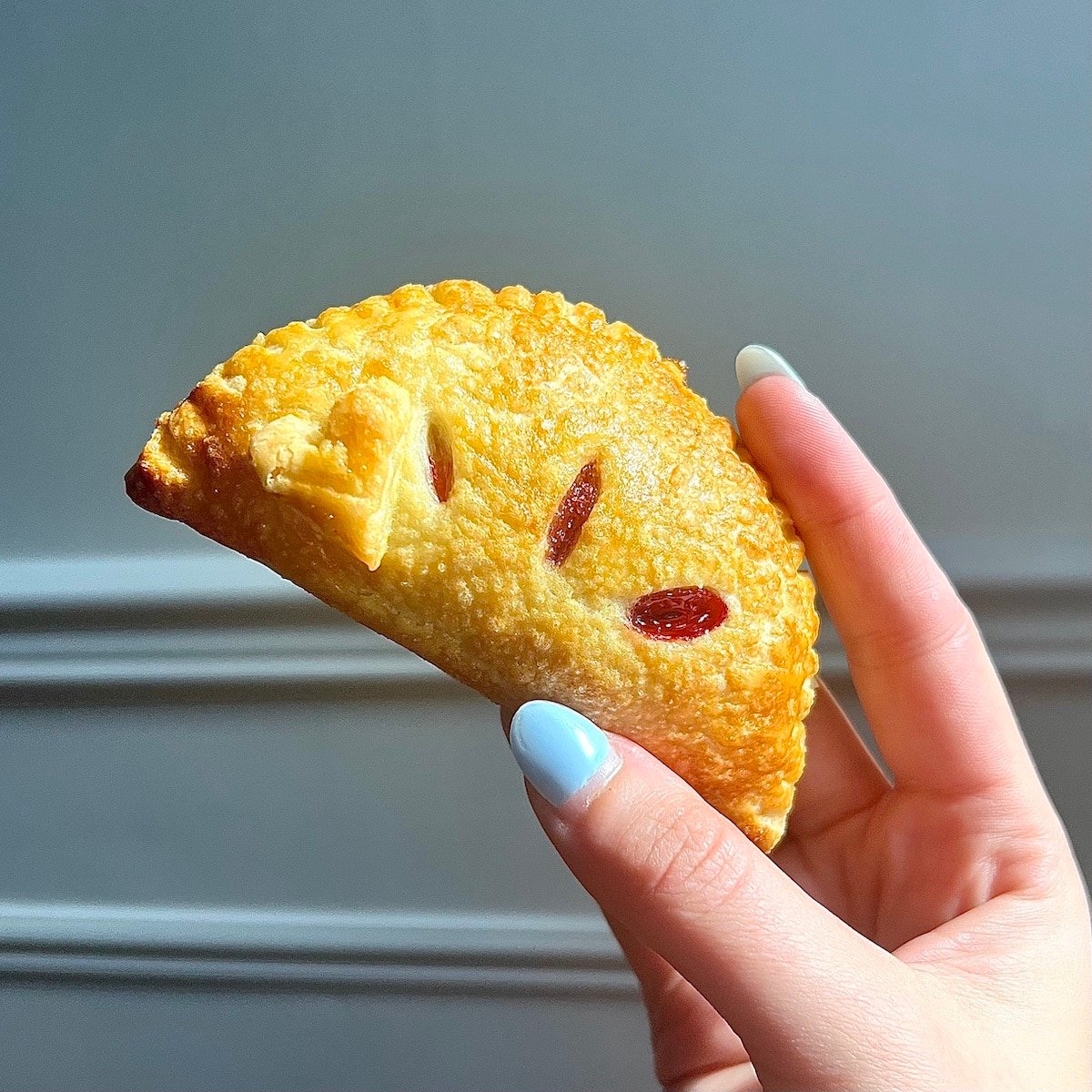 A crispy golden hand pie, fresh from the oven.