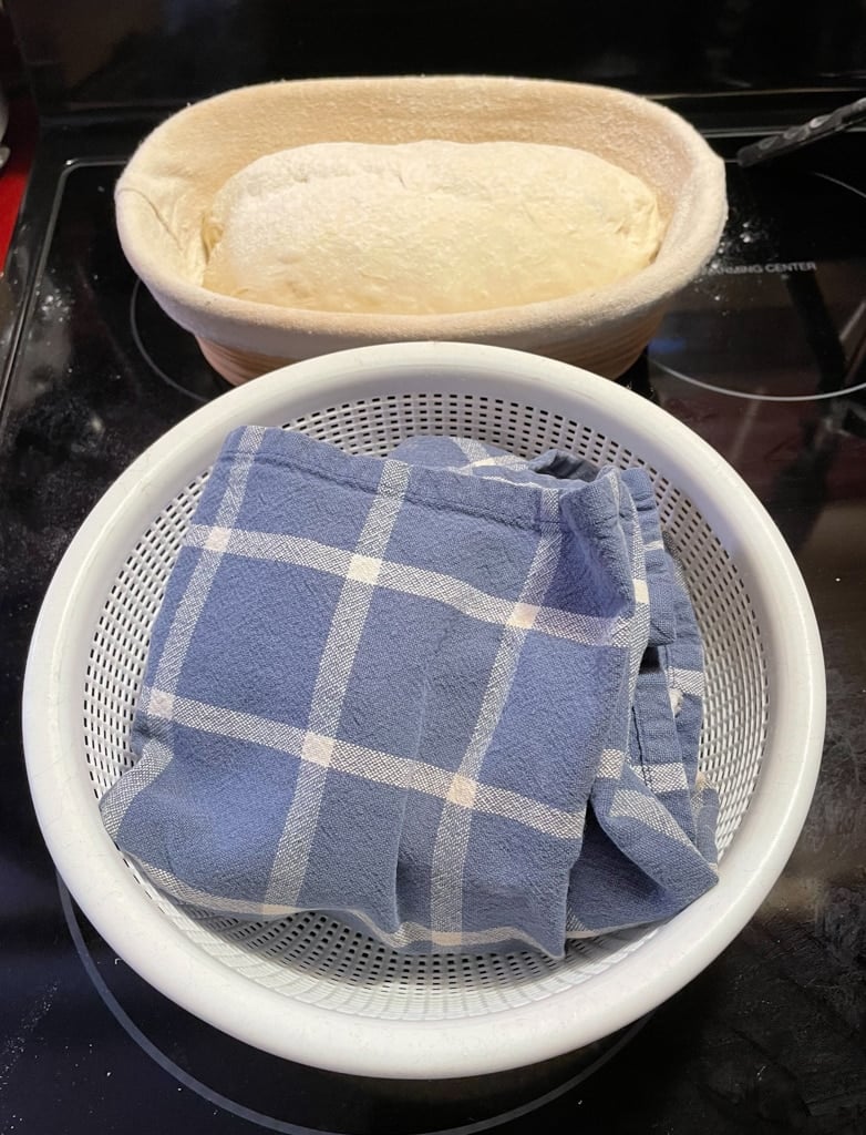 Fold the cloth over the dough.