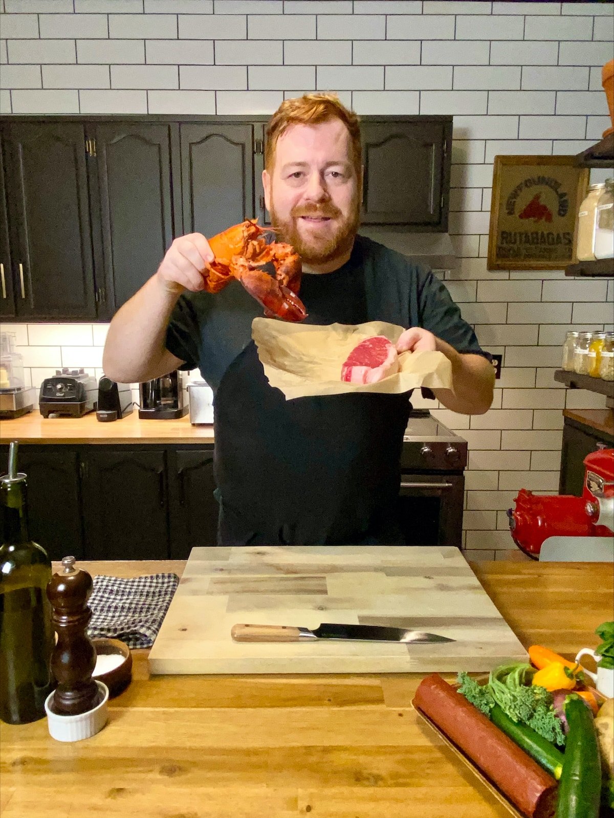 Chef Mark McCrowe holding a lobster.