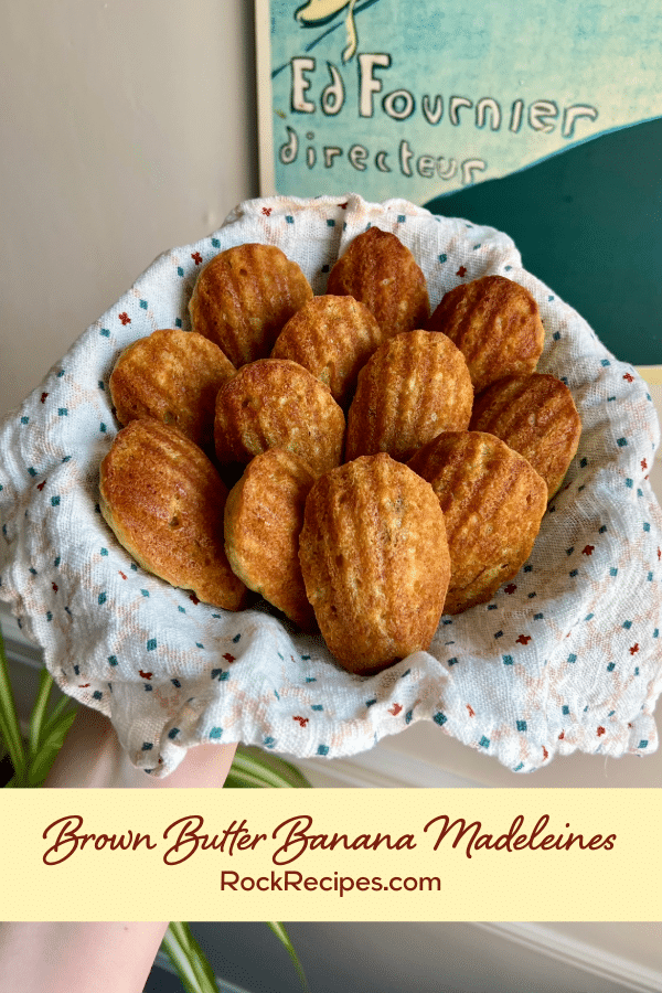 A basket of madeleines with title text overlay on the image.