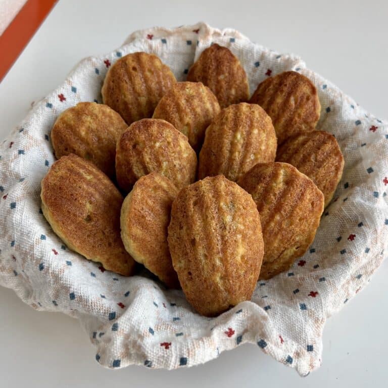 A basket of freshly baked madeleines.