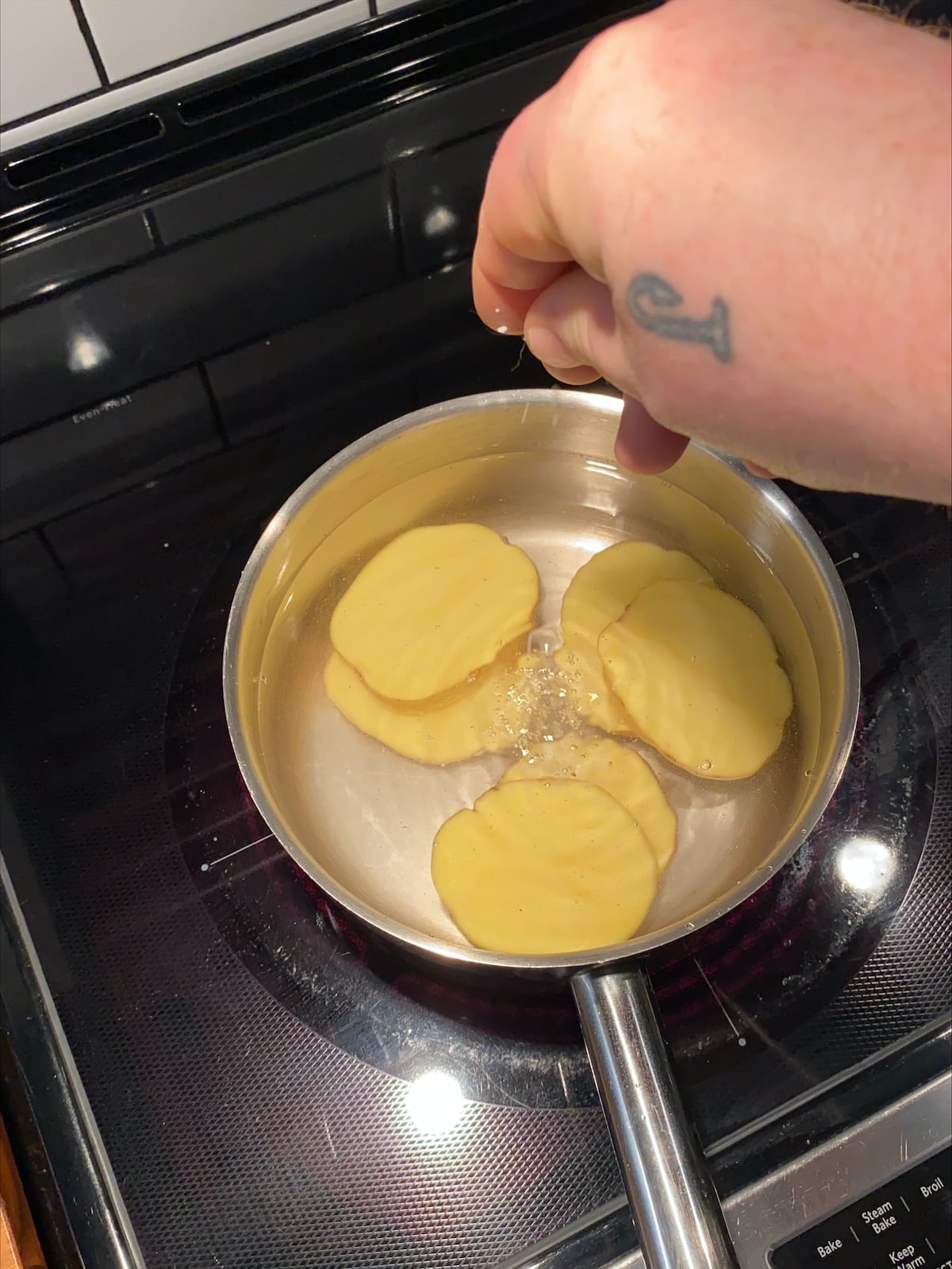 Seasoning potatoes with salt