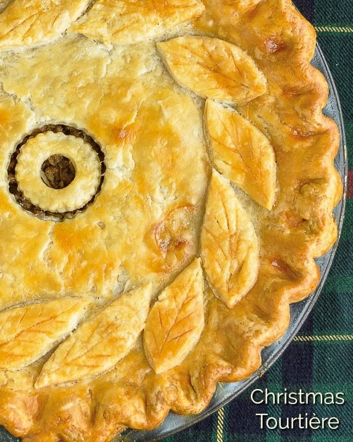 Christmas Tourtière slice on a gold and white plate with title text added for social media