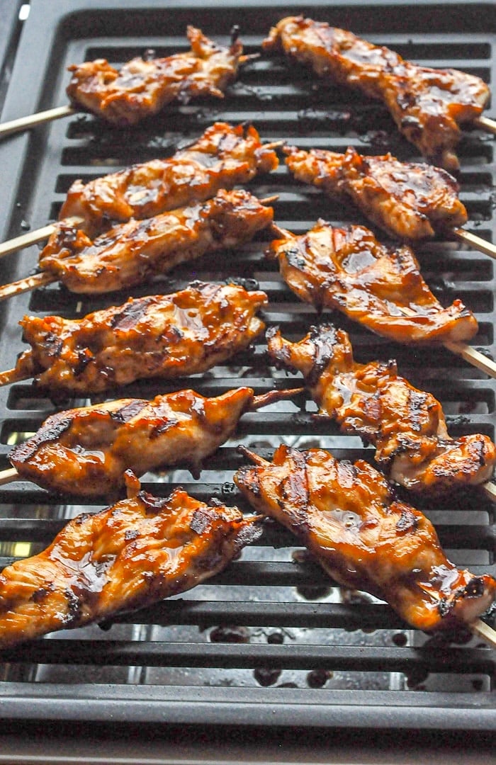 Peanut Butter Sriracha Chicken Satay shown on an electric grill.
