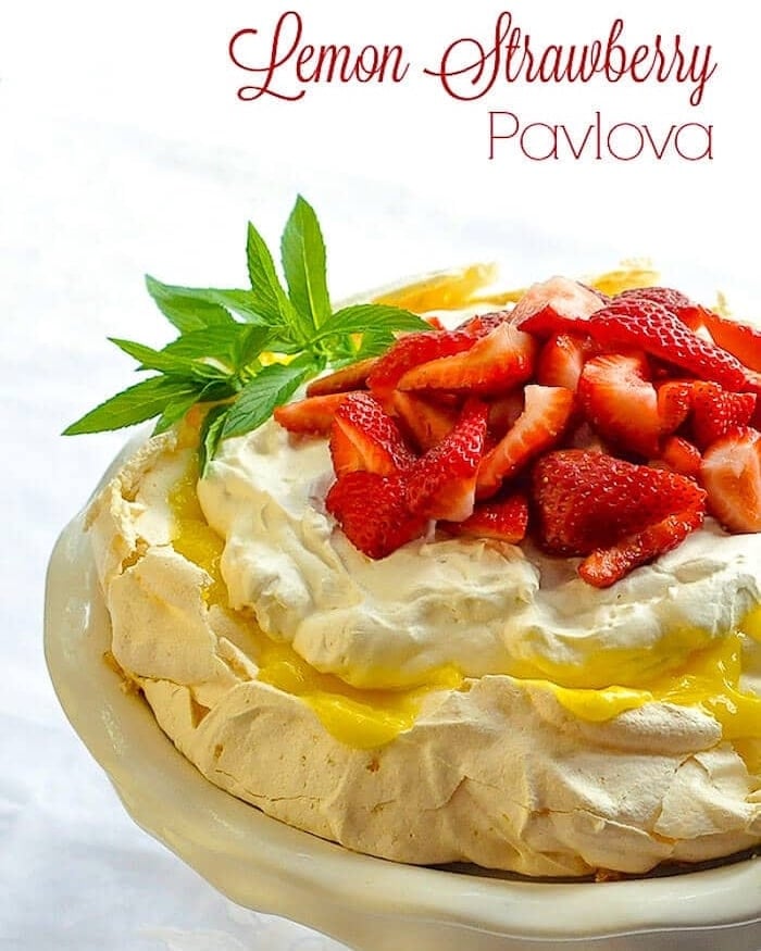 Lemon Pavlova with Strawberries photo with title text added for Pinterest and social media posts.