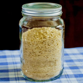 How to make dried bread crumbs, photo of crumbs in a mason jar square cropped for Google featured image.