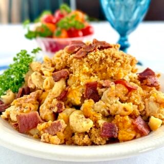 Bacon Macaroni and Cheese photo of one serving on a white plate for featured image.