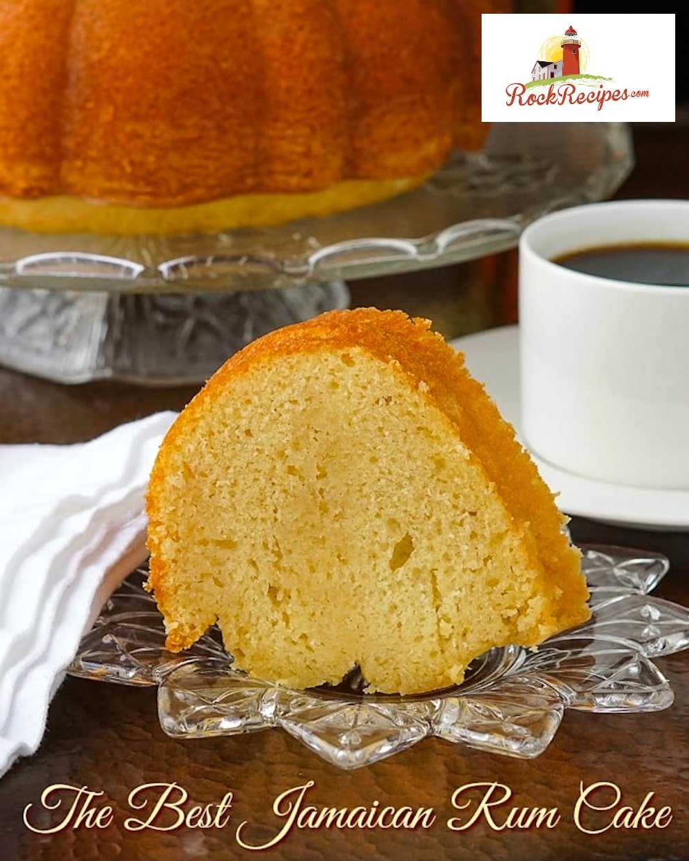 Jamaican Rum Cake photo of a single slice with title text added for social media posting.
