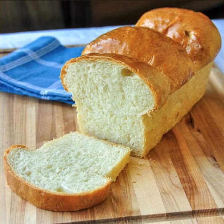 The Best Homemade White Bread close up photo of cut loaf for featured Google image.