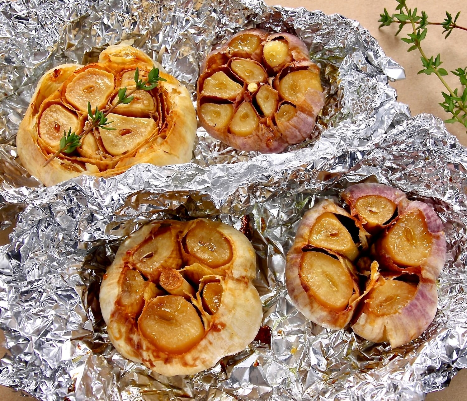 photo of roasted garlic that has been cooked in aluminum foil.