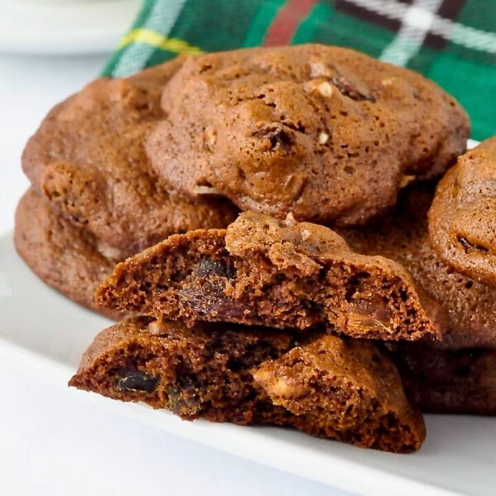 Newfoundland Lassy Mogs with Newfoundland tartan napkin in the background. cookies are stacked on a white plate