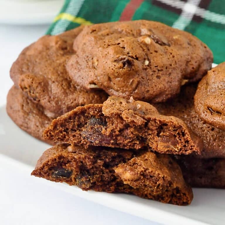 Newfoundland Lassy Mogs with Newfoundland tartan napkin in the background. cookies are stacked on a white plate