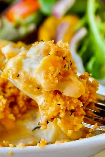 The Best Cod au Gratin close up photo of a bite if the dish on a fork.