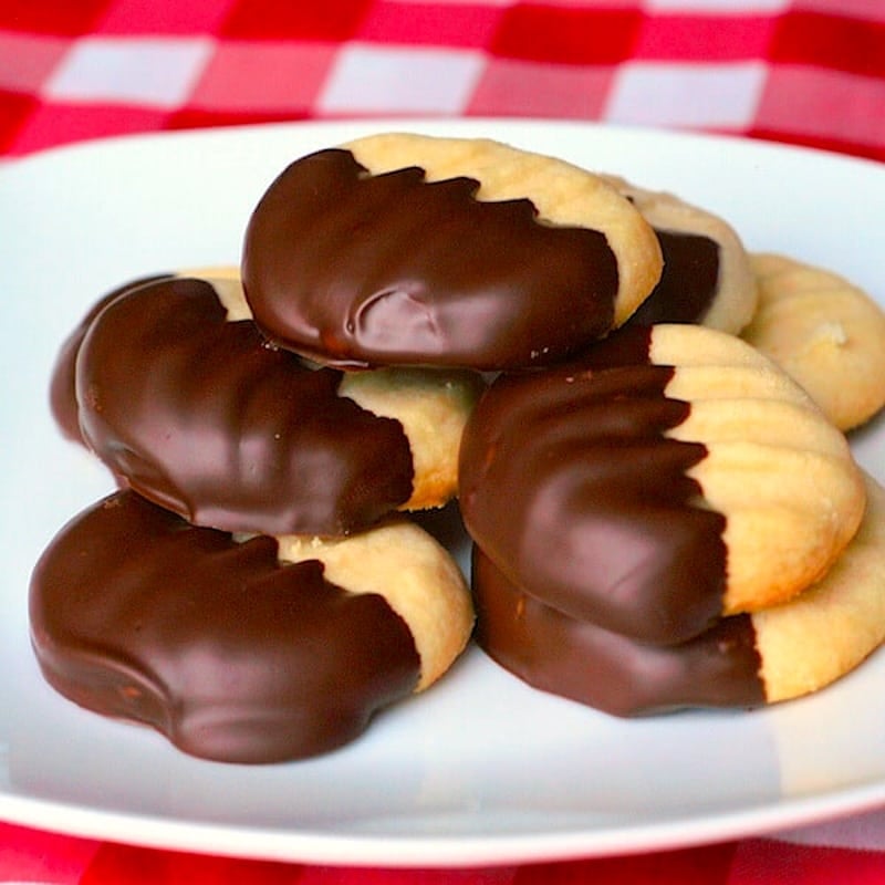 Chocolate Dipped Melting Moments on a white plate.