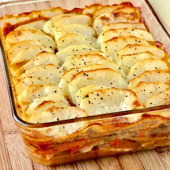 Leftover Turkey Cottage Pie photo of a cooked casserole with sliced potato topping.