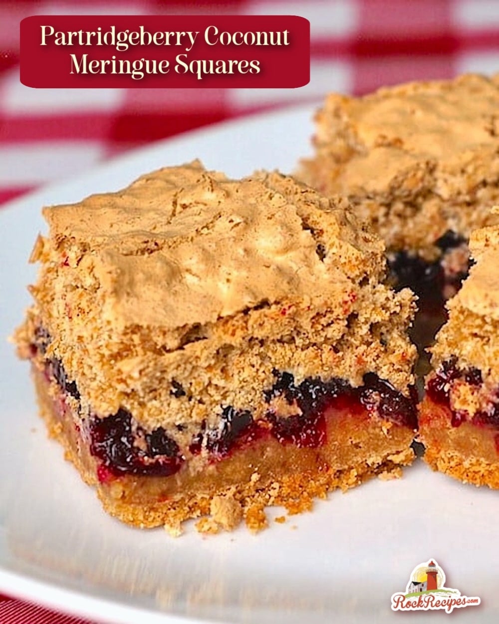 Partridgeberry Coconut Meringue Squares cropped featured image of cut squares on a white plate with title text added for Pinterest and social media posts.