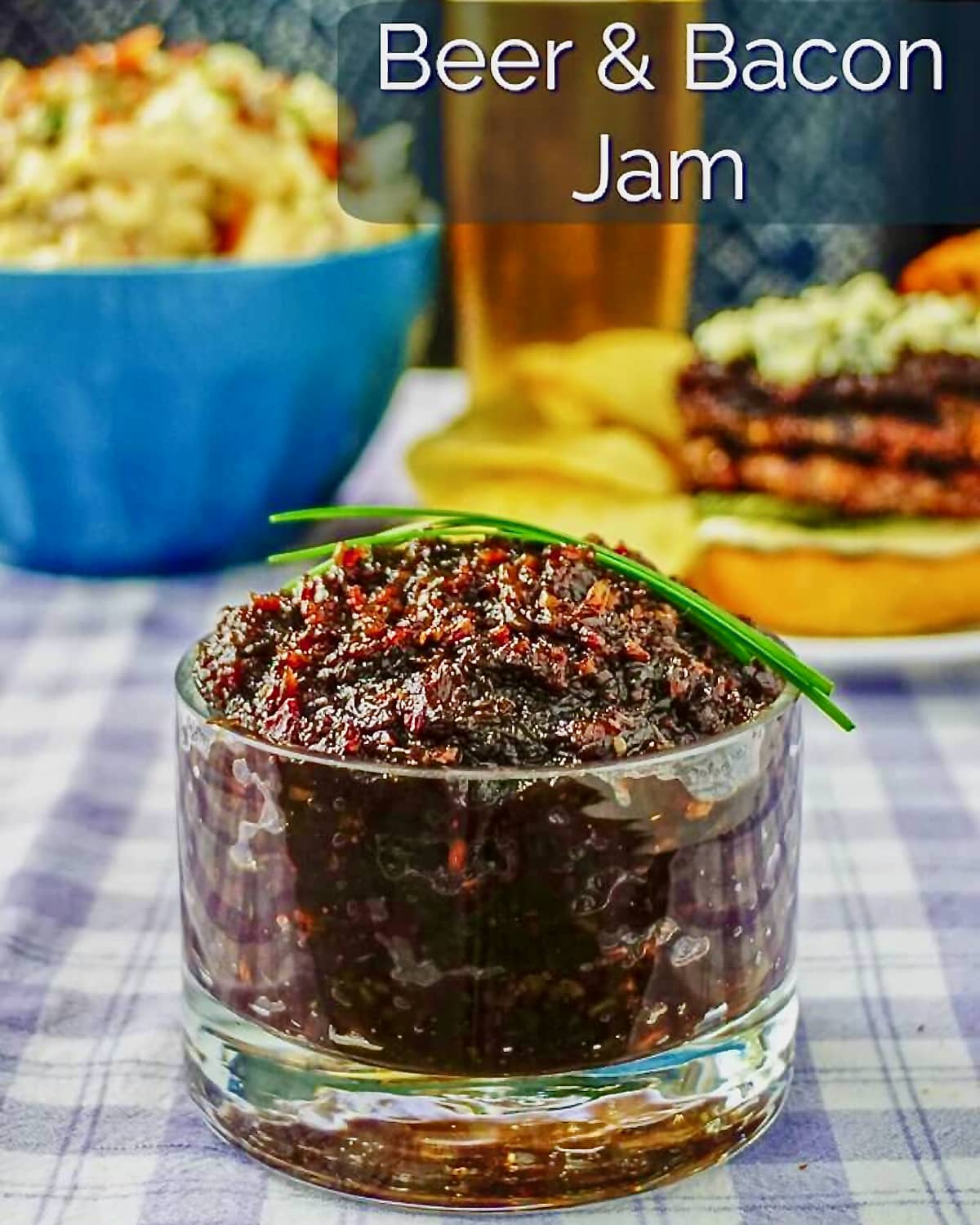 Beer and Bacon Jam in a clear glass serving dish with title text added for social media posts.