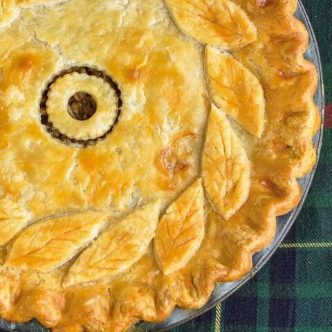 Rock Recipes Christmas Tourtière photo of uncut pie for featured google image.
