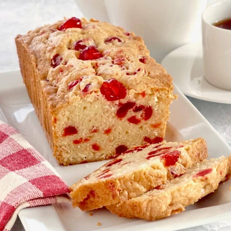 Newfoundland Cherry Cake photo of a sliced loaf cake on a white platter