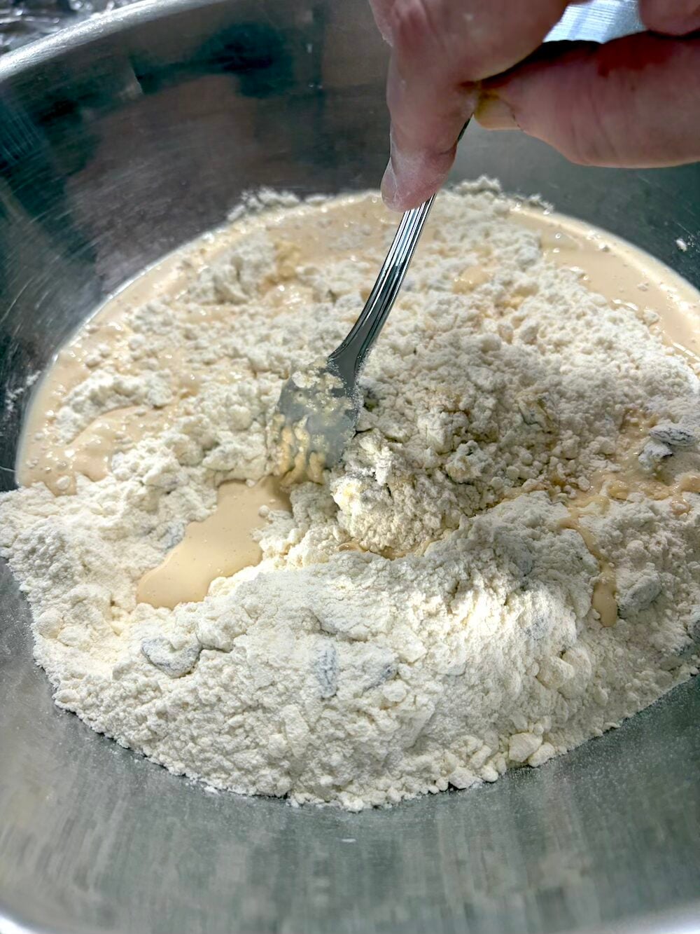 Pulling the ingredients together with a fork.