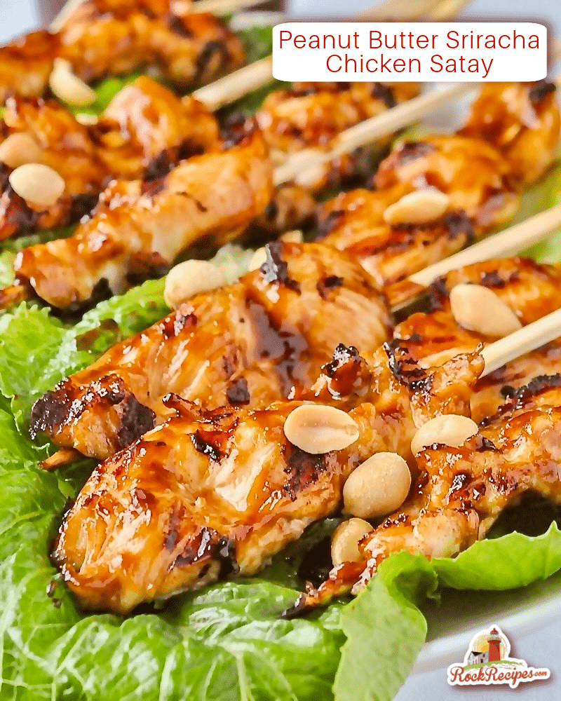 Photo of Peanut Butter Sriracha Chicken Satay skewers on a bed of lettuce with title text added for social media posts.