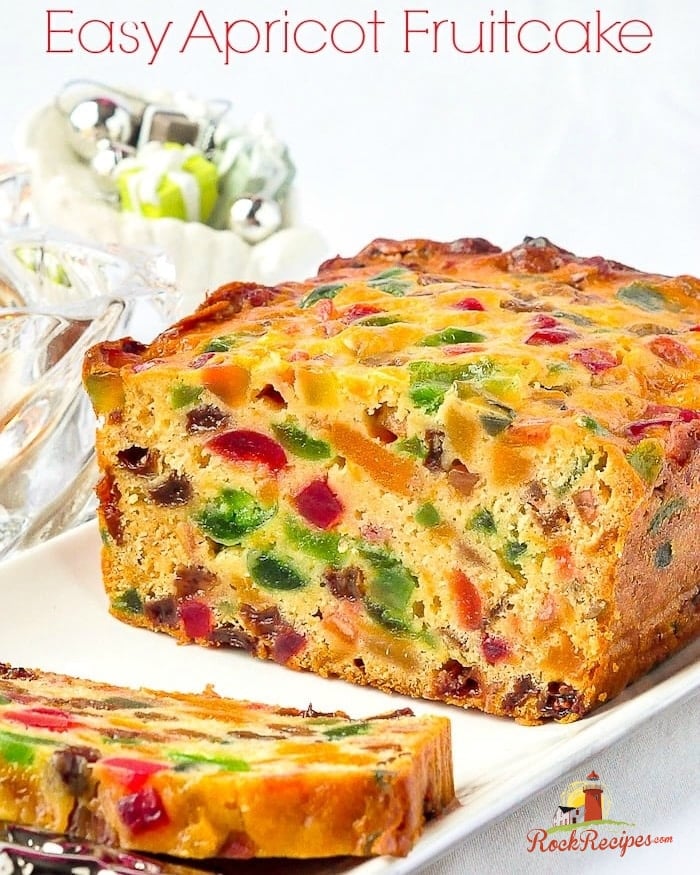 Sliced Apricot Fruitcake with title text added for Social media.
