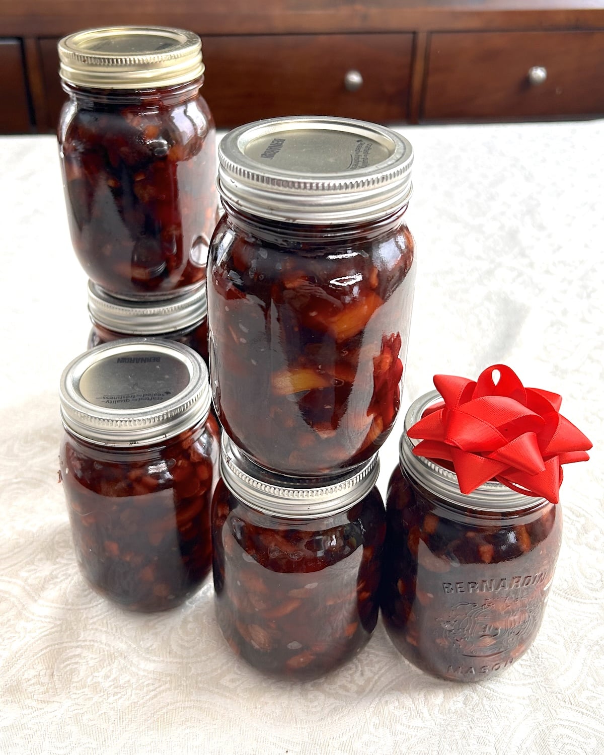 A cluster of mason jars filled with fruit