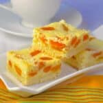 Apricot Coconut Cookie Bars photo of cookies stacked oin a white tray